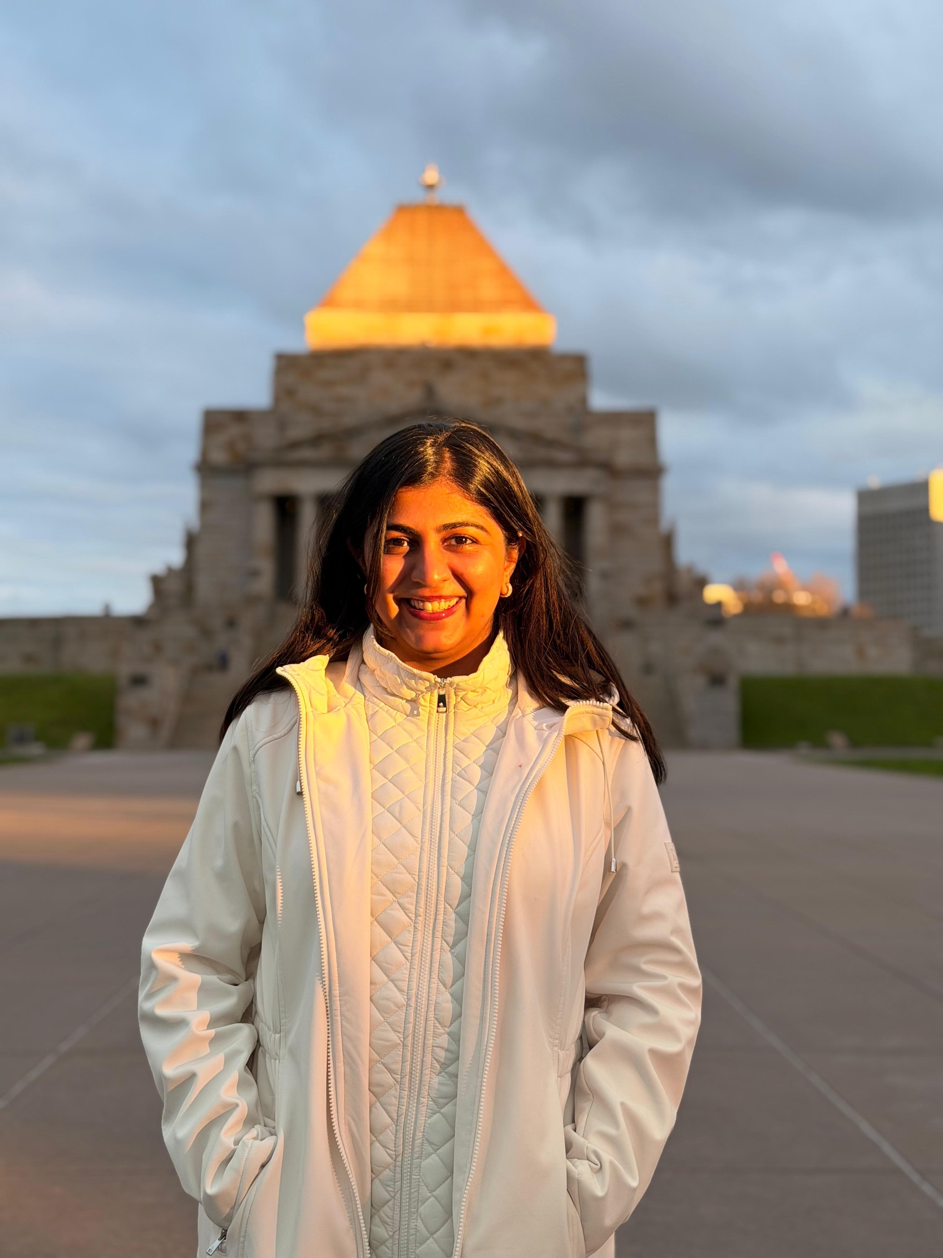Simran Verma smiling outdoors in warm sunlight